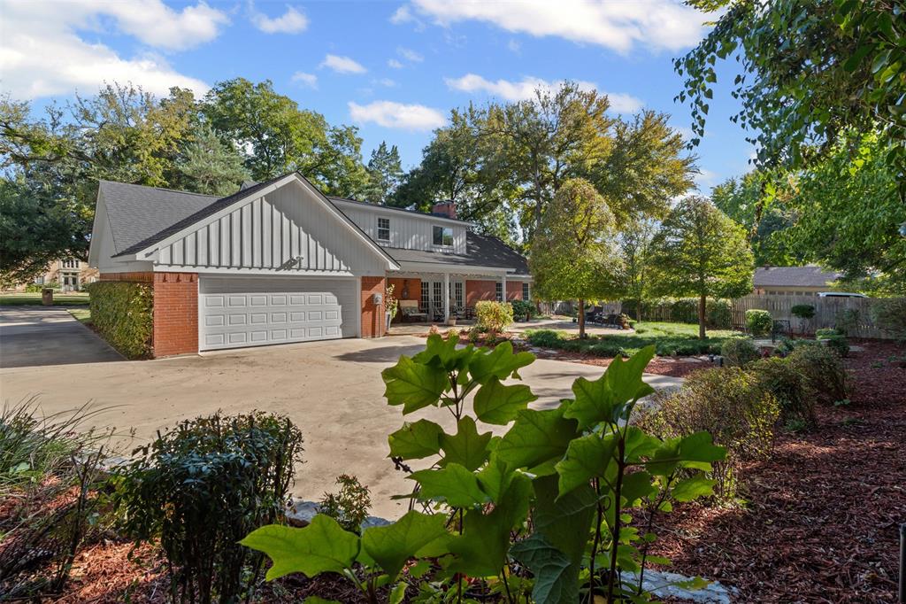 3800 Hollow Creek Road Benbrook, TX 76116 - Photo 29 of 29 a front view of house with yard and trees in the background