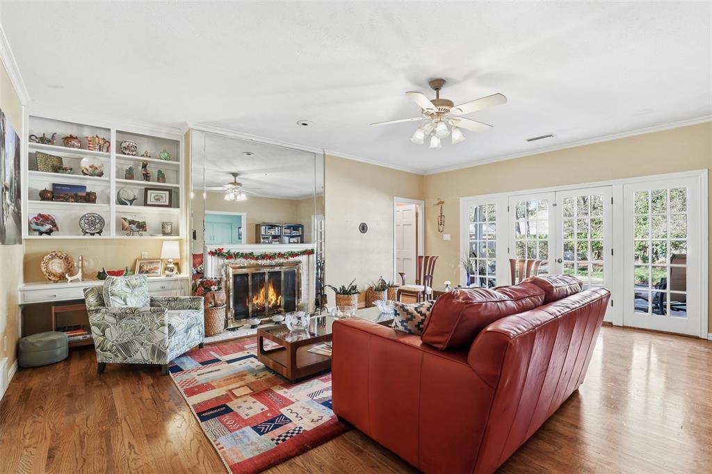 3800 Hollow Creek Road Benbrook, TX 76116 - Photo 5 of 29 a living room with furniture fireplace and a large window