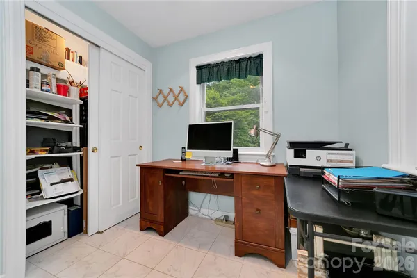 a view of a workspace with furniture