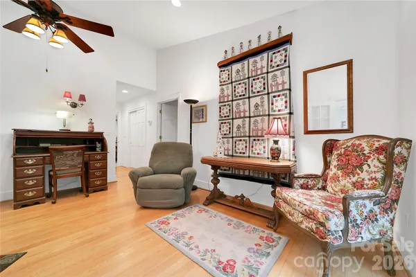 a bedroom with furniture and a window