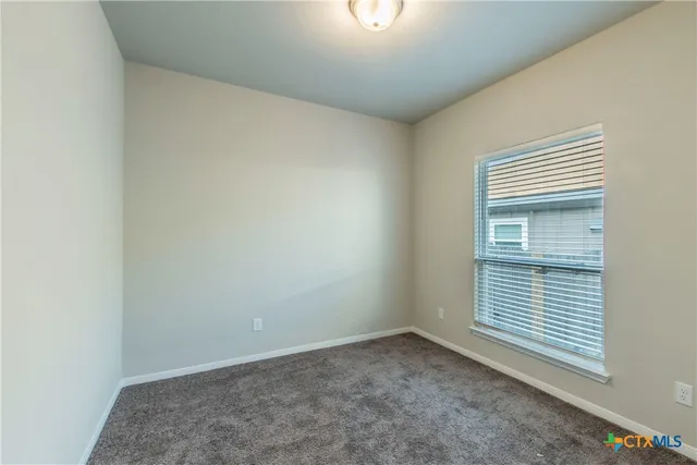 an empty room with closet area