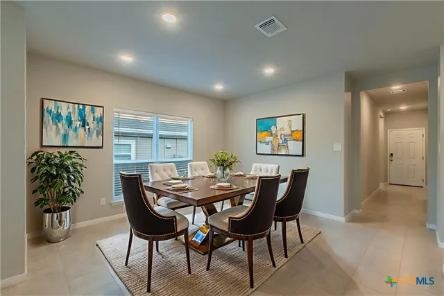 a view of a dining room with furniture