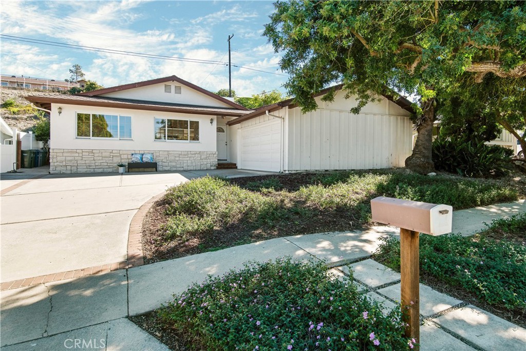 27040 Springcreek Road Rancho Palos Verdes, CA 90275 - Photo 1 of 1 a front view of a house with garden