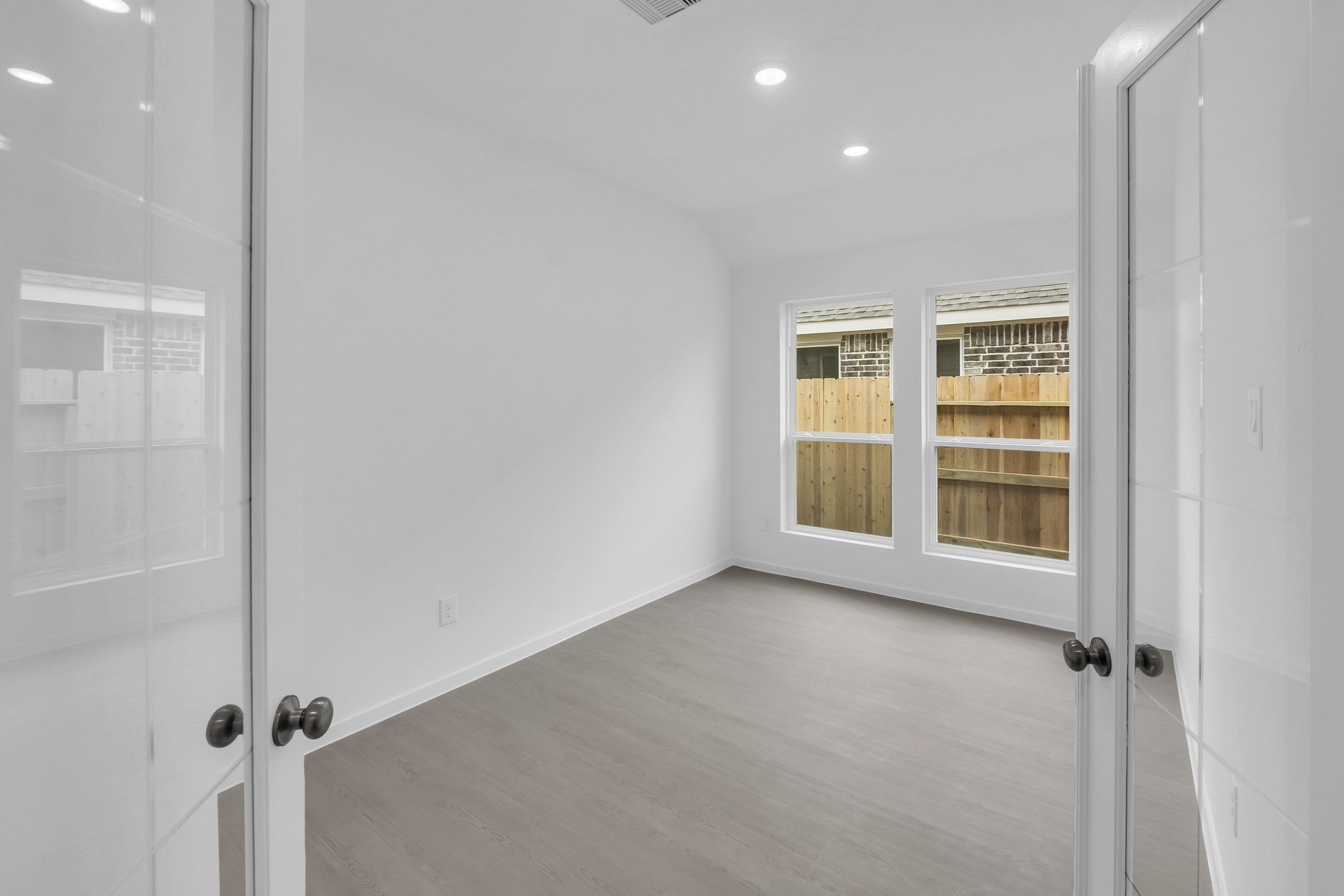 2135 Mosaic Vly Court Angleton, TX 77515 - Photo 3 of 15 a view of an empty room with a window