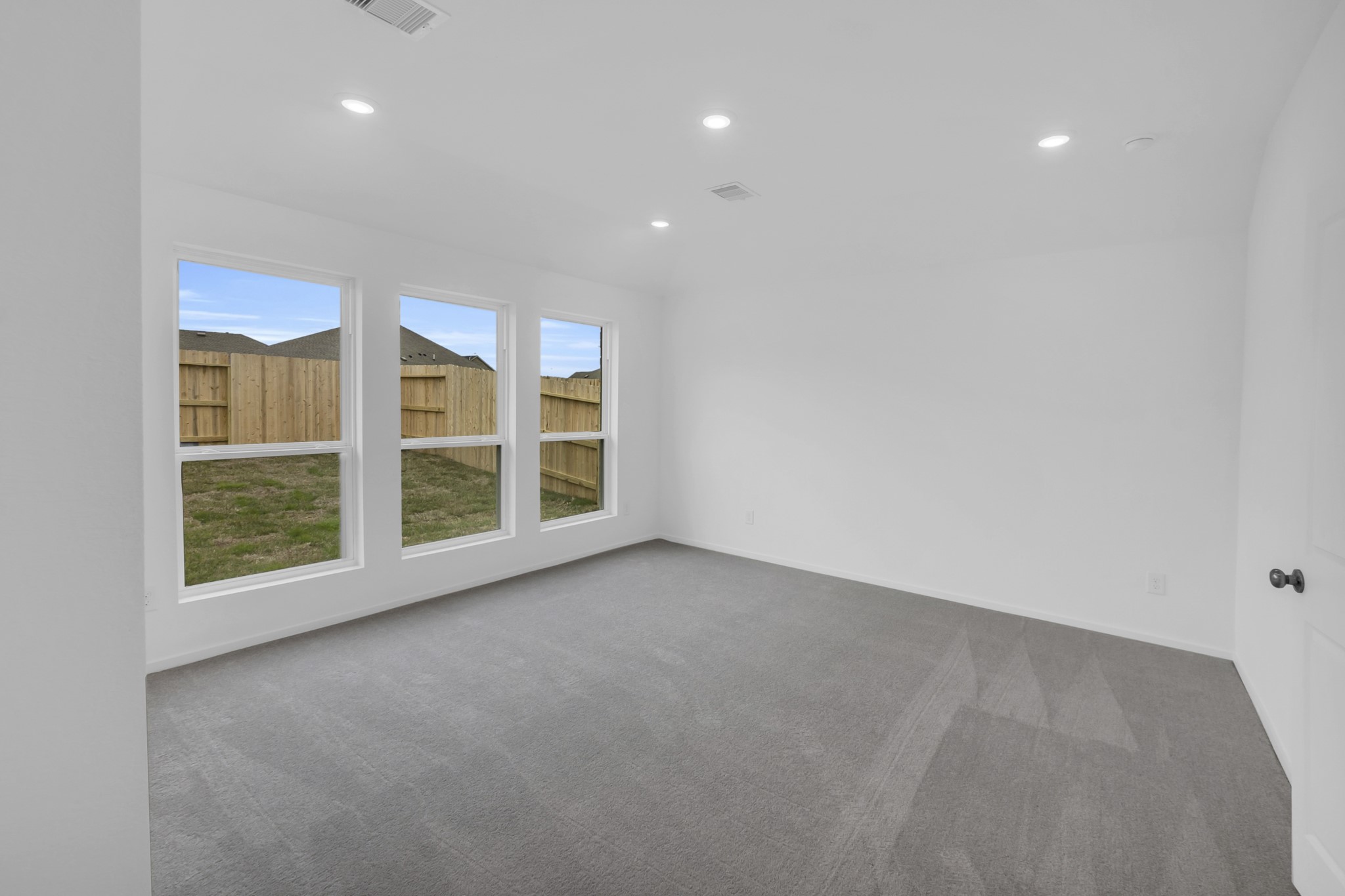 2135 Mosaic Vly Court Angleton, TX 77515 - Photo 7 of 15 a view of an empty room with a window
