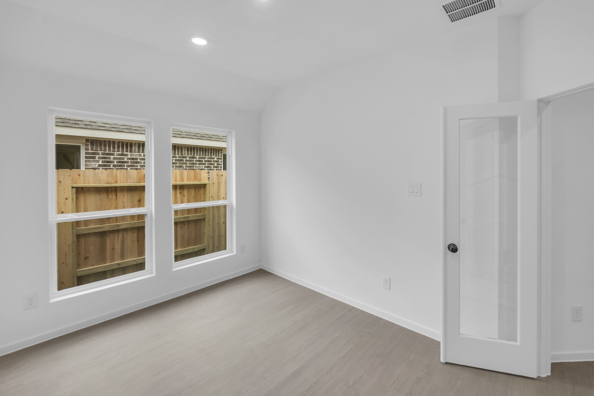 2135 Mosaic Vly Court Angleton, TX 77515 - Photo 8 of 15 a view of an empty room with a window