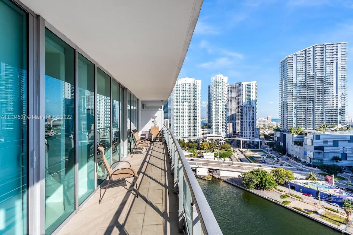 92 Southwest 3rd Street, Unit 2003 Miami, FL 33130 - Photo 1 of 30 a view of balcony with outdoor seating and city view