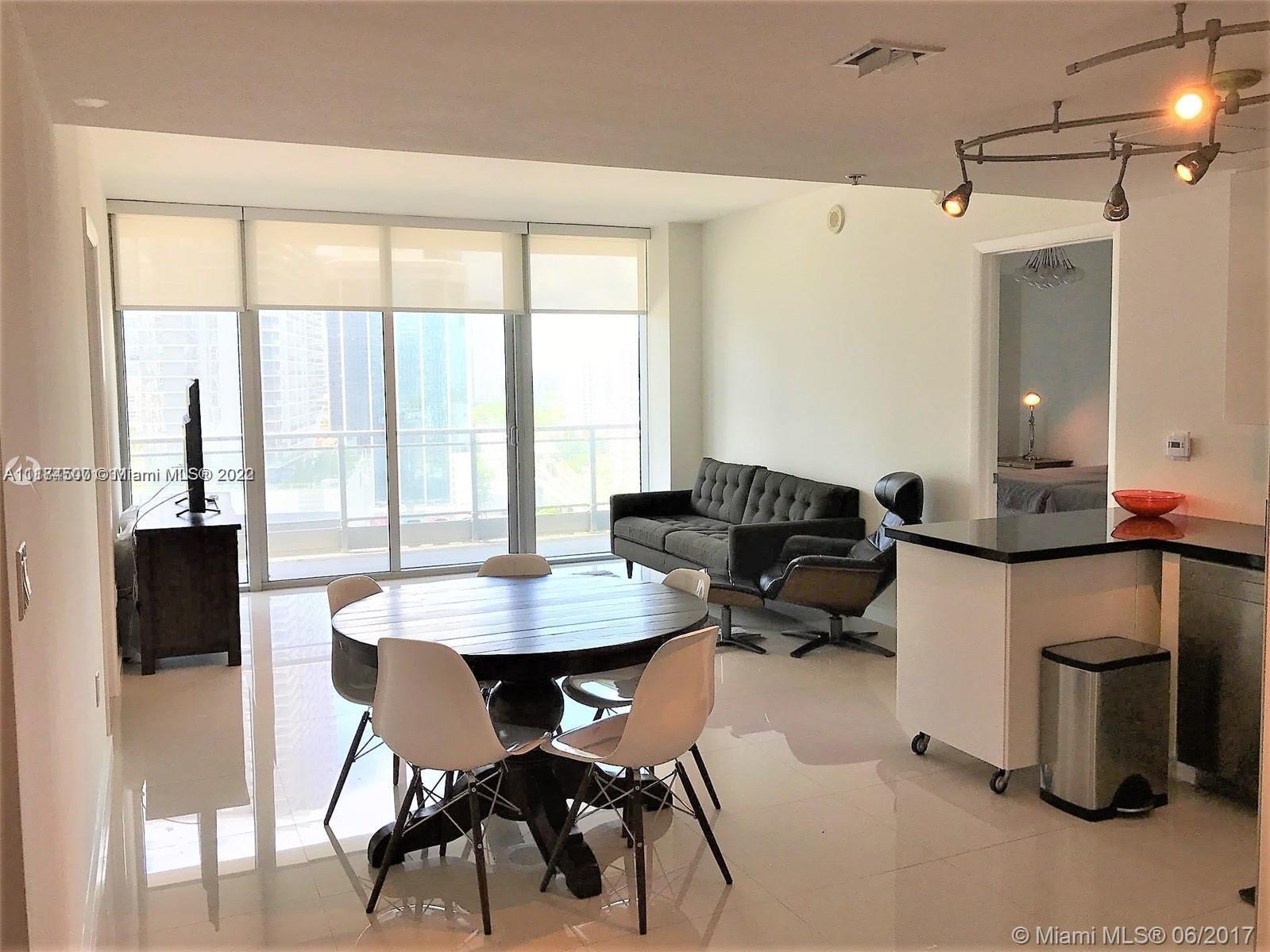 92 Southwest 3rd Street, Unit 2003 Miami, FL 33130 - Photo 12 of 30 a workspace with furniture and a window