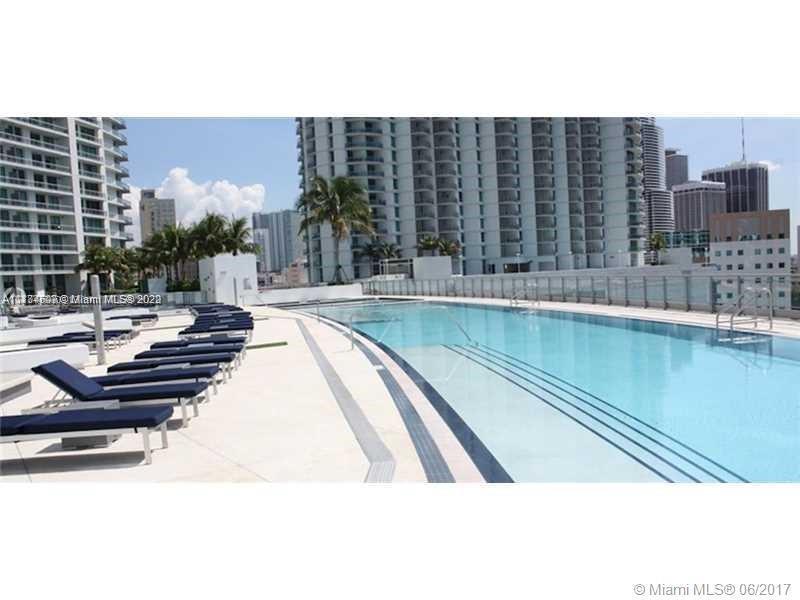 92 Southwest 3rd Street, Unit 2003 Miami, FL 33130 - Photo 29 of 30 a view of swimming pool with outdoor seating