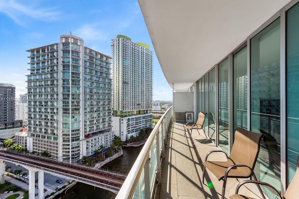 92 Southwest 3rd Street, Unit 2003 Miami, FL 33130 - Photo 5 of 30 a view of balcony with wooden floor and outdoor seating