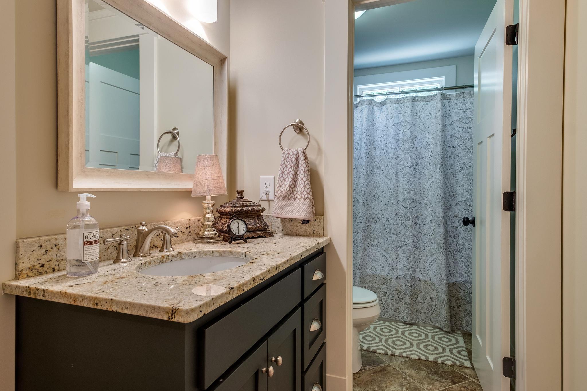 1036 Ridglea Drive Burns, TN 37029 - Photo 24 of 28 Guest Bathroom w/ Tub/Shower Combo and Tile Floors