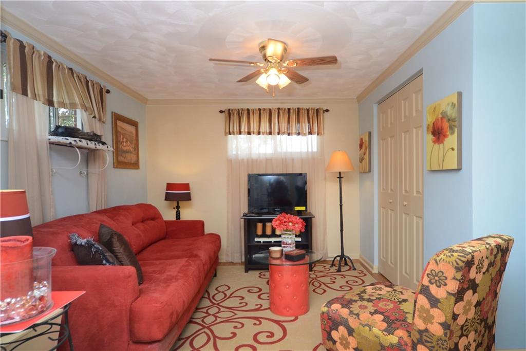 2209 North Forest Grove Road Coraopolis, PA 15108 - Photo 11 of 25 First Floor Master/In-law Suite currently set up as a sitting room with a Murphy pull-down bed in the closet.