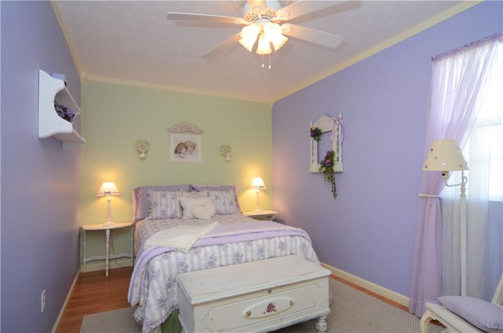 2209 North Forest Grove Road Coraopolis, PA 15108 - Photo 18 of 25 Bedroom #3 features a lighted double door closet, laminate flooring and crown molding.