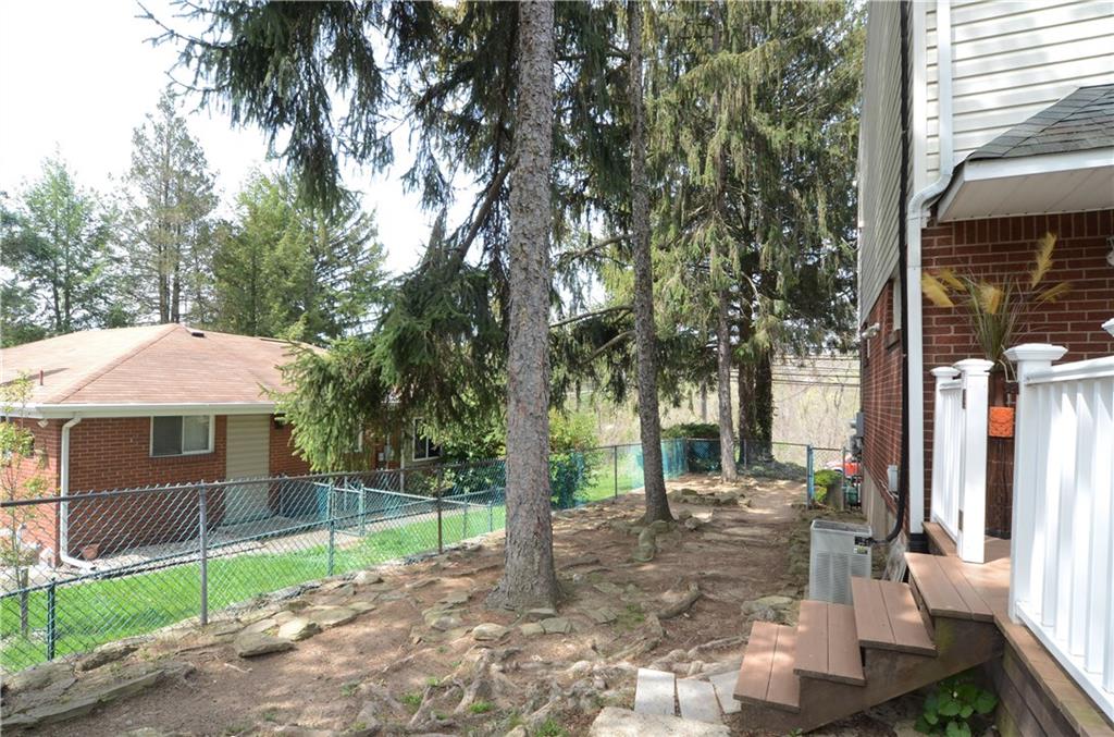 2209 North Forest Grove Road Coraopolis, PA 15108 - Photo 24 of 25 The completely fenced dog run is 60x16. Trees provide shade and there is also lighting for those evening runs.