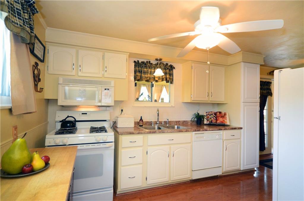 2209 North Forest Grove Road Coraopolis, PA 15108 - Photo 6 of 25 Kitchen includes gas stove, built-in microwave, refrigerator, dishwasher and 2 tall pantry cabinets.