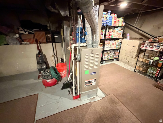 737 Wasatch Street Midvale, UT 84047 - Photo 20 of 29 Utility area featuring a Carrier furnace, exposed ductwork, and concrete block walls