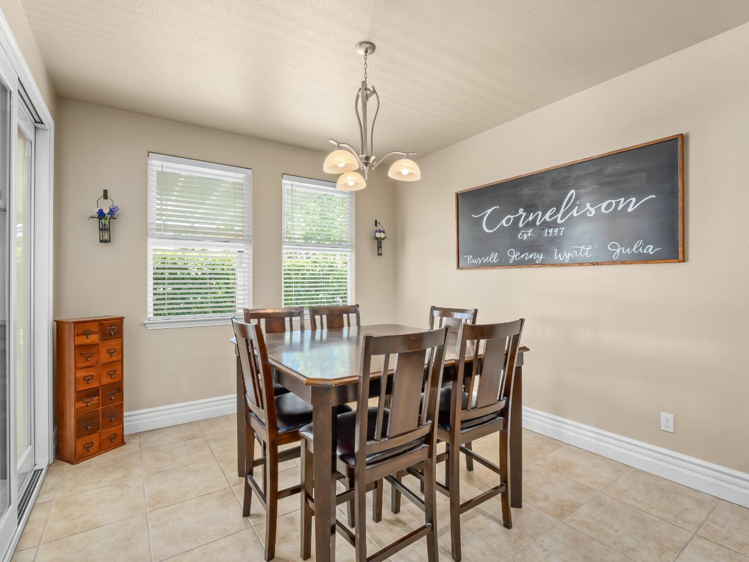 948 Whitmore Avenue Clovis, CA 93619 - Photo 11 of 38 a view of a dining room with furniture window and outside view