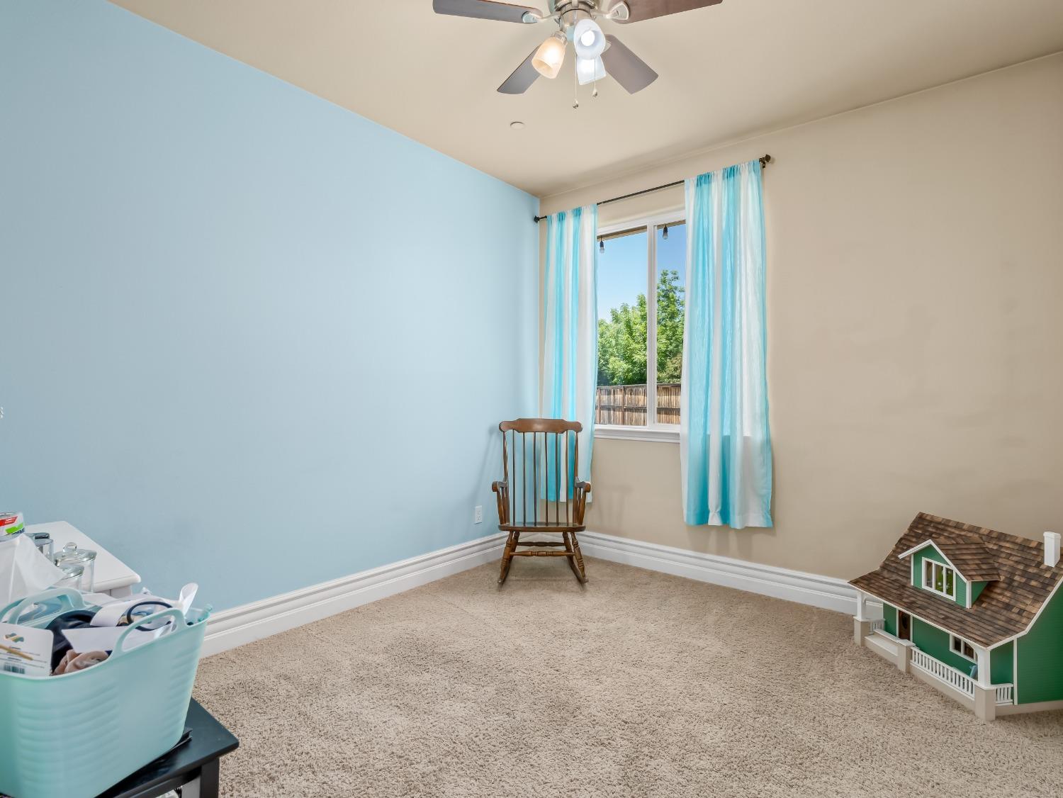 948 Whitmore Avenue Clovis, CA 93619 - Photo 16 of 38 a living room with furniture and a window