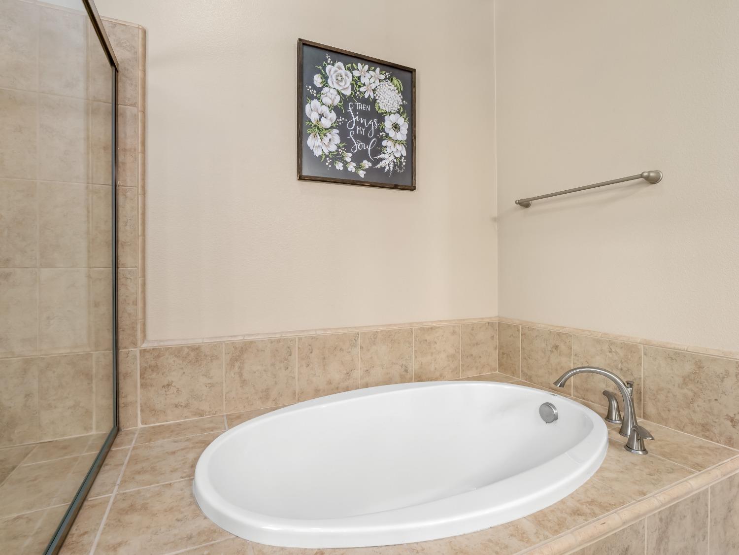 948 Whitmore Avenue Clovis, CA 93619 - Photo 24 of 38 a bathroom with a tub