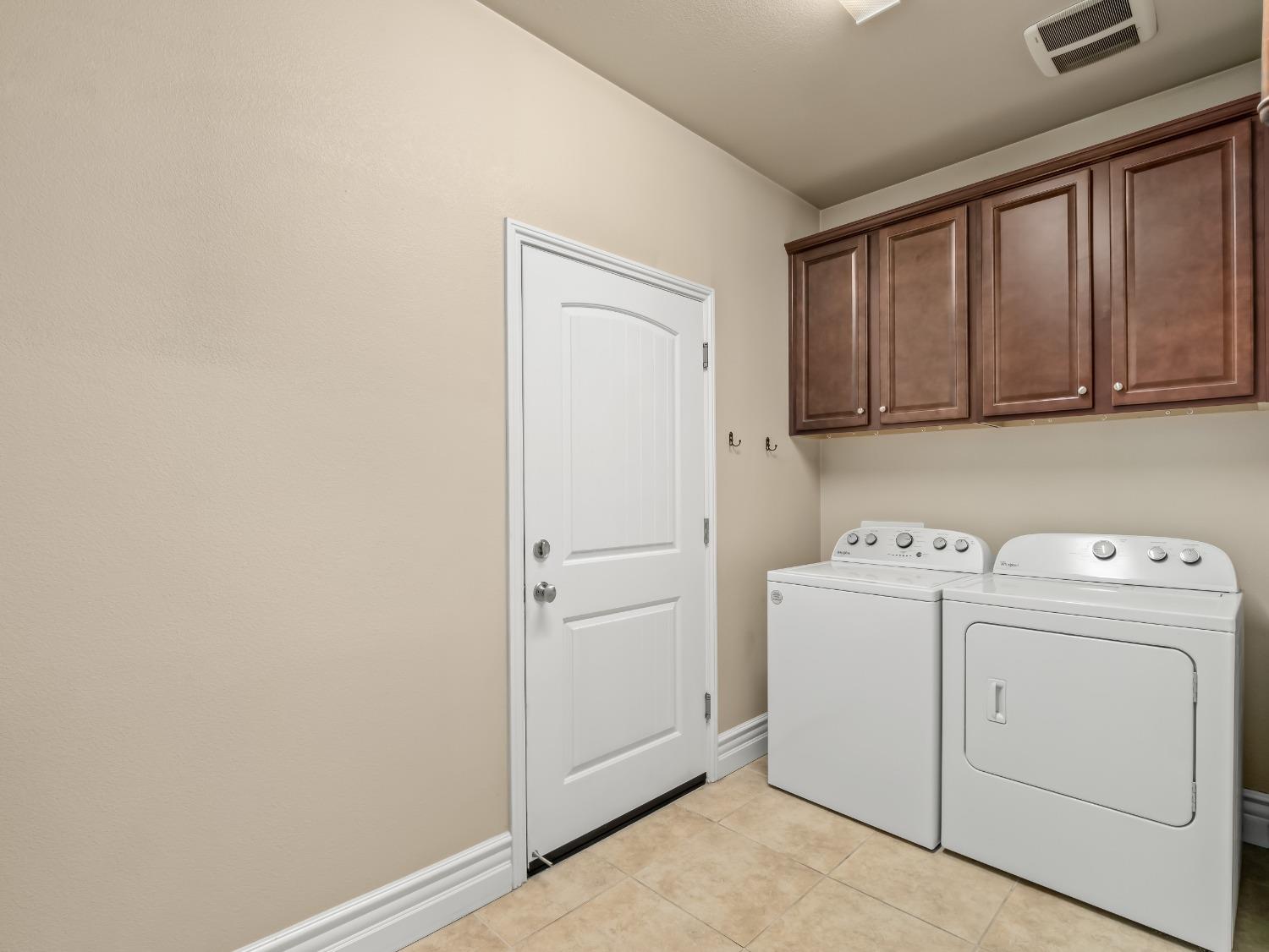 948 Whitmore Avenue Clovis, CA 93619 - Photo 25 of 38 a view of storage and utility room with washer and dryer