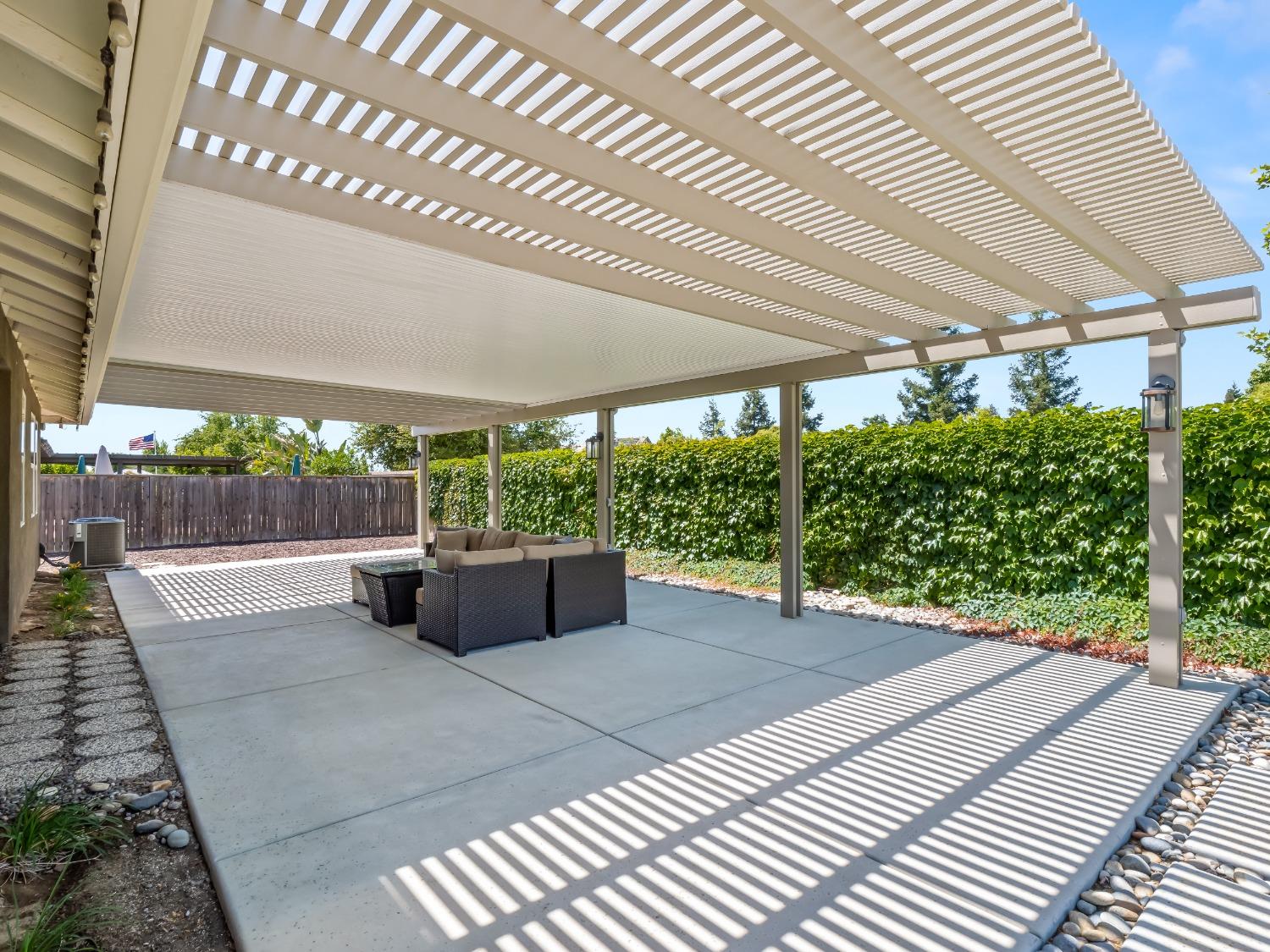 948 Whitmore Avenue Clovis, CA 93619 - Photo 27 of 38 a view of a patio with a yard