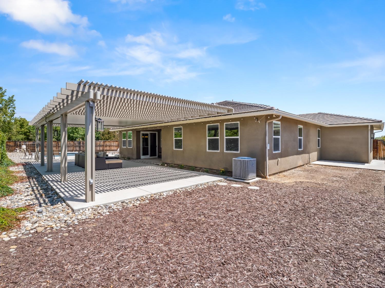 948 Whitmore Avenue Clovis, CA 93619 - Photo 32 of 38 a front view of a house with a garden