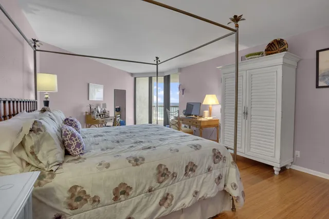 a bed room with a bed and a mirror