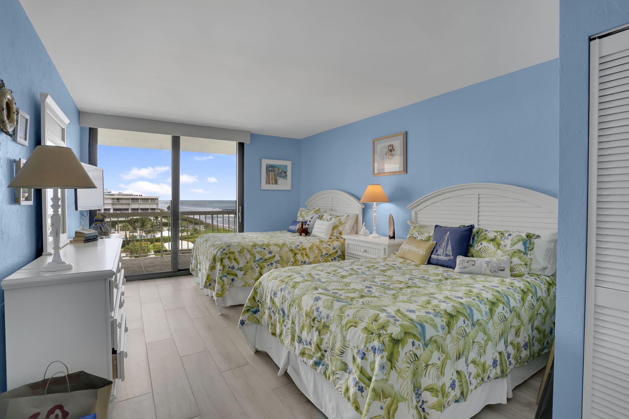 3300 South Ocean Boulevard, Unit 504S Palm Beach, FL 33480 - Photo 21 of 24 a bedroom with two beds and a large window