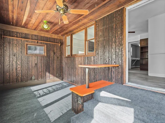 a house with swimming pool in front of it