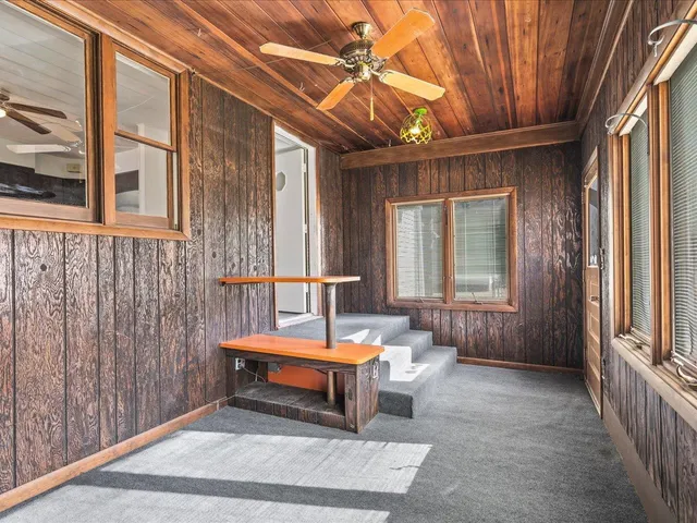 a outdoor space with lots of furniture and windows