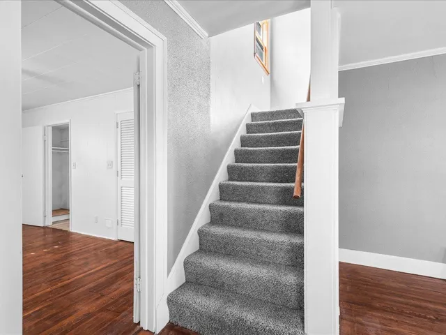 a view of an entryway with wooden floor