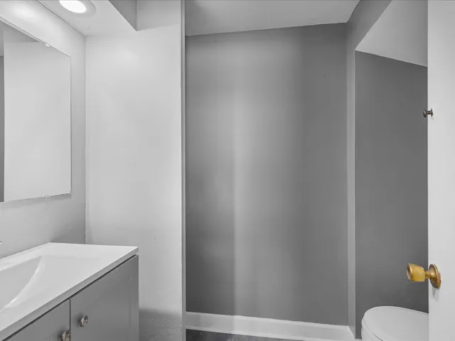 a bathroom with a sink toilet and