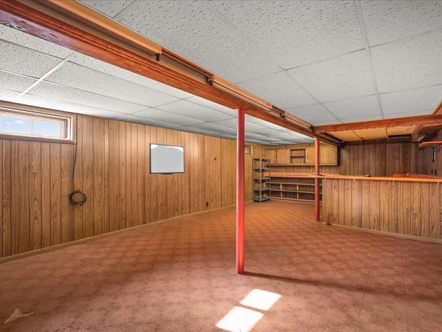 a view of an empty room with a fireplace