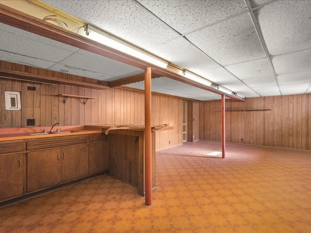 a view of an empty room with a fireplace