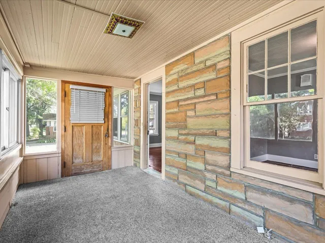 a view of empty room with windows