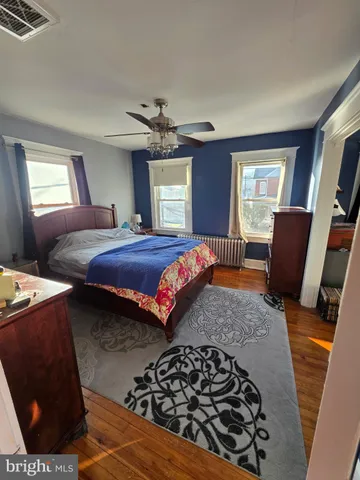 a bedroom with bed and window