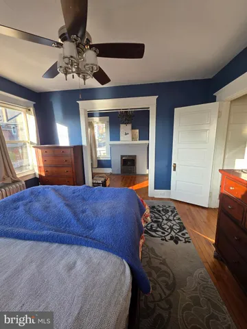 a bedroom with a large bed and a television