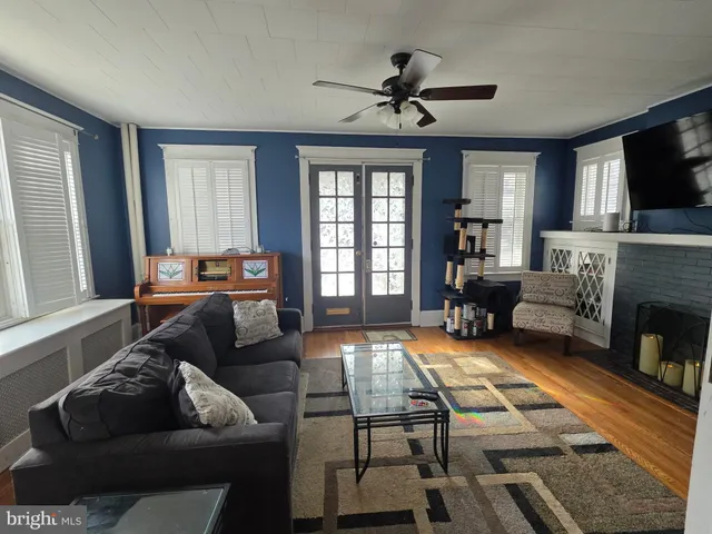 a living room with furniture fireplace and a flat screen tv