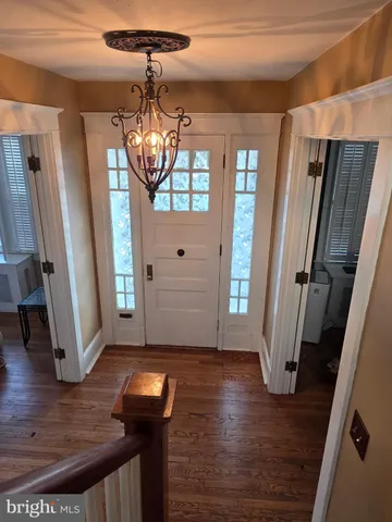 a view of entryway with wooden floor