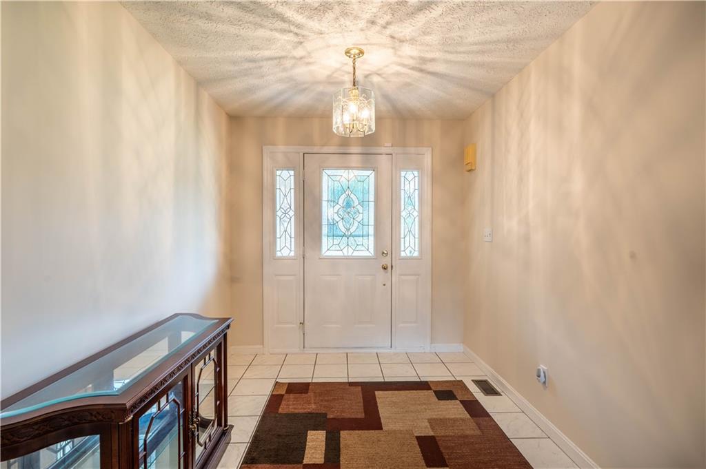 4487 Battle Ridge Road Oakdale, PA 15071 - Photo 11 of 46 a view of an entryway with a chandelier