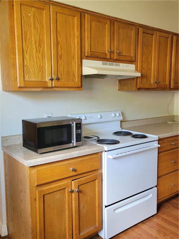 5557 Beacon Street Pittsburgh, PA 15217 - Photo 13 of 14 a stove top oven sitting inside of a kitchen