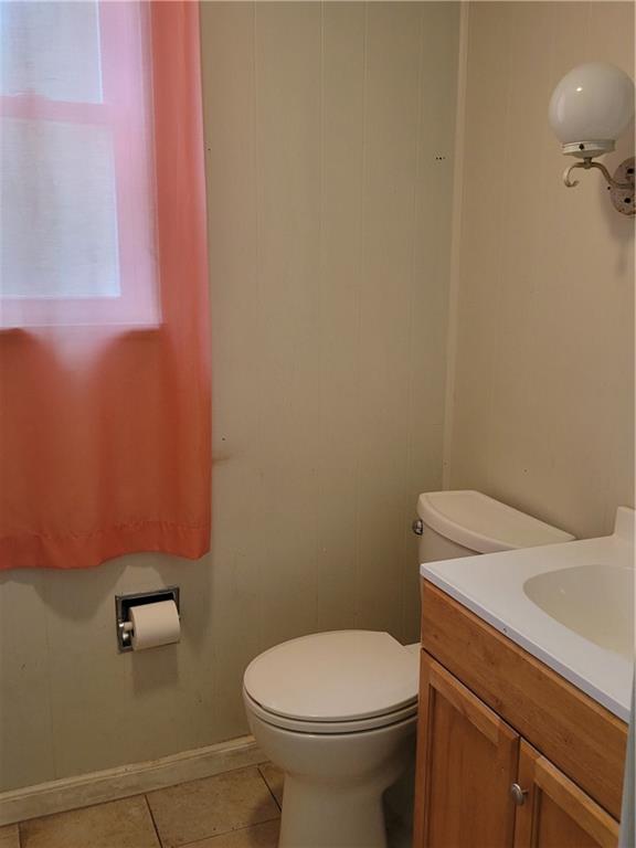 5557 Beacon Street Pittsburgh, PA 15217 - Photo 14 of 14 a bathroom with a sink a toilet and a mirror