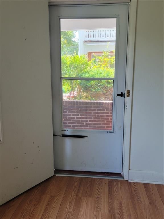 5557 Beacon Street Pittsburgh, PA 15217 - Photo 2 of 14 a view of an empty room with wooden floor and a window