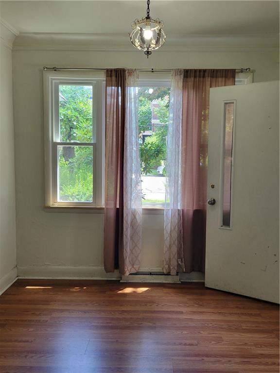 5557 Beacon Street Pittsburgh, PA 15217 - Photo 3 of 14 a view of an empty room with wooden floor and a window