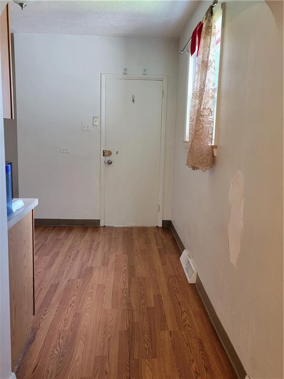 5557 Beacon Street Pittsburgh, PA 15217 - Photo 5 of 14 a view of a room with wooden floor and white walls