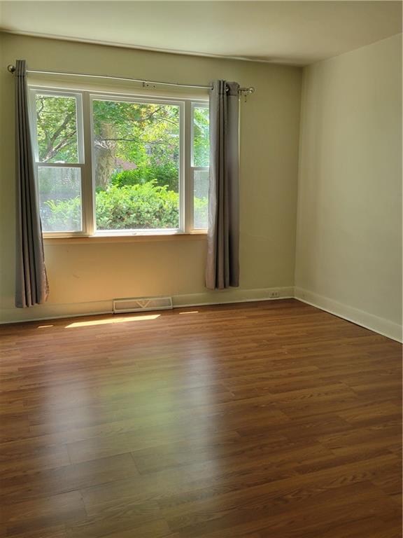 5557 Beacon Street Pittsburgh, PA 15217 - Photo 7 of 14 a view of room with window and wooden floor