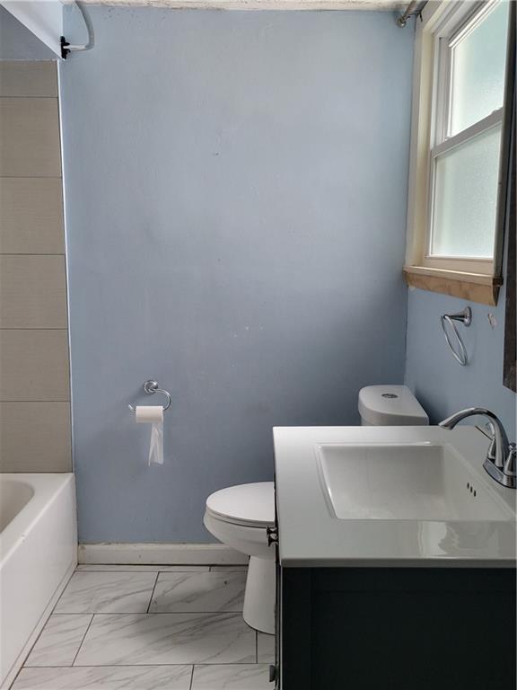 5557 Beacon Street Pittsburgh, PA 15217 - Photo 8 of 14 a bathroom with a sink a toilet and bathtub