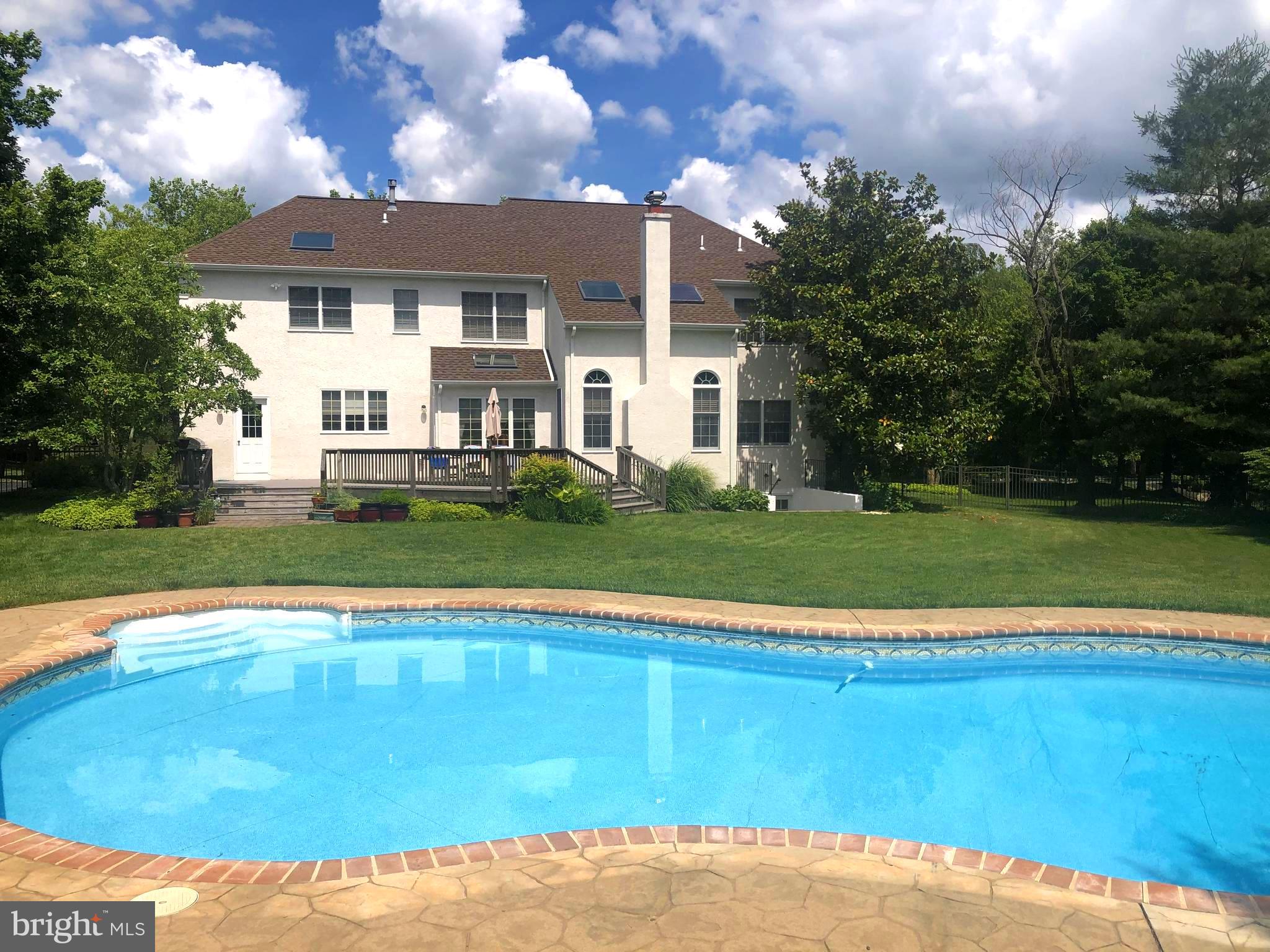 205 Christopher Drive Princeton, NJ 08540 - Photo 2 of 45 Backyard with deck, patio & pool.