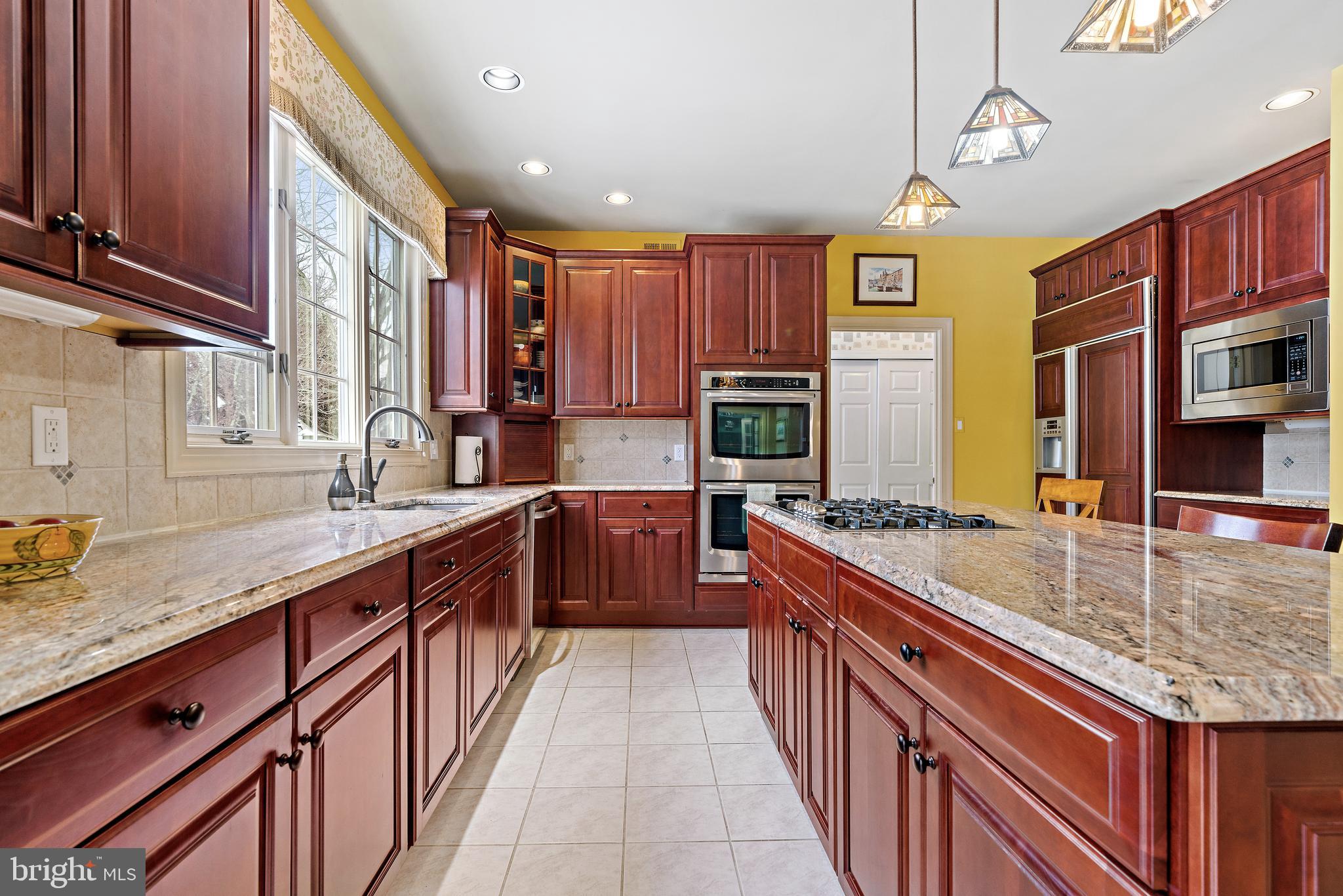 205 Christopher Drive Princeton, NJ 08540 - Photo 15 of 45 Remodeled kitchen with cherry cabinets.