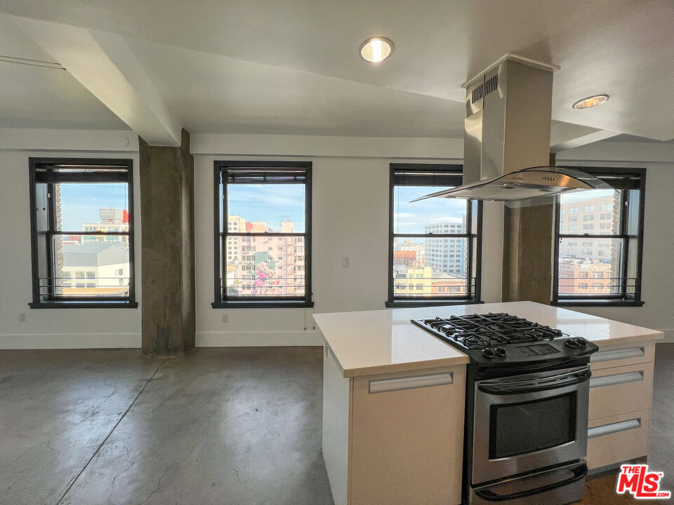 a kitchen that has a stove and a sink